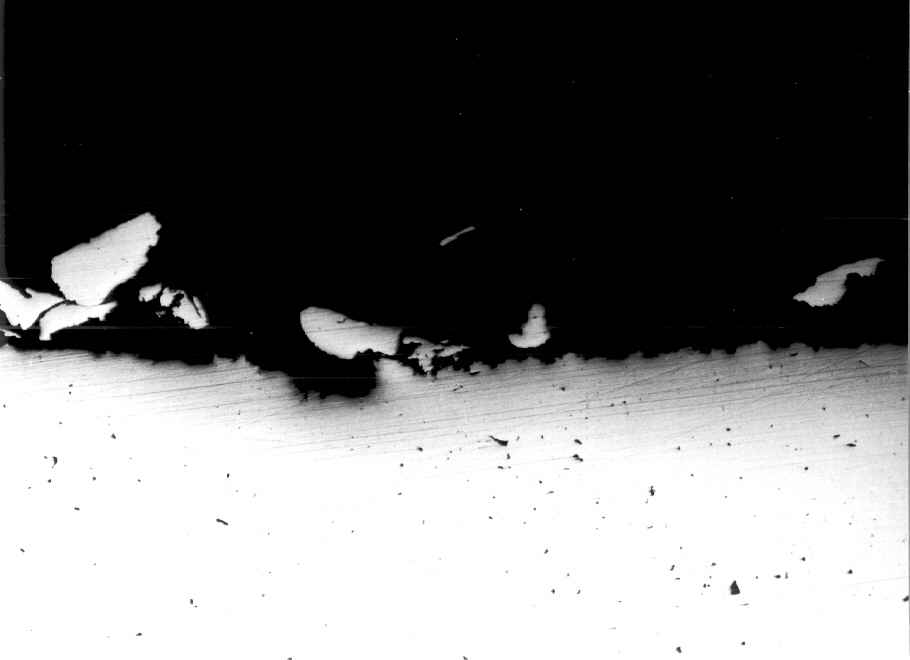 edge of eroded area (magnification: x 50; optical microscopy)